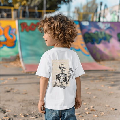 a young boy standing in front of a skateboard ramp