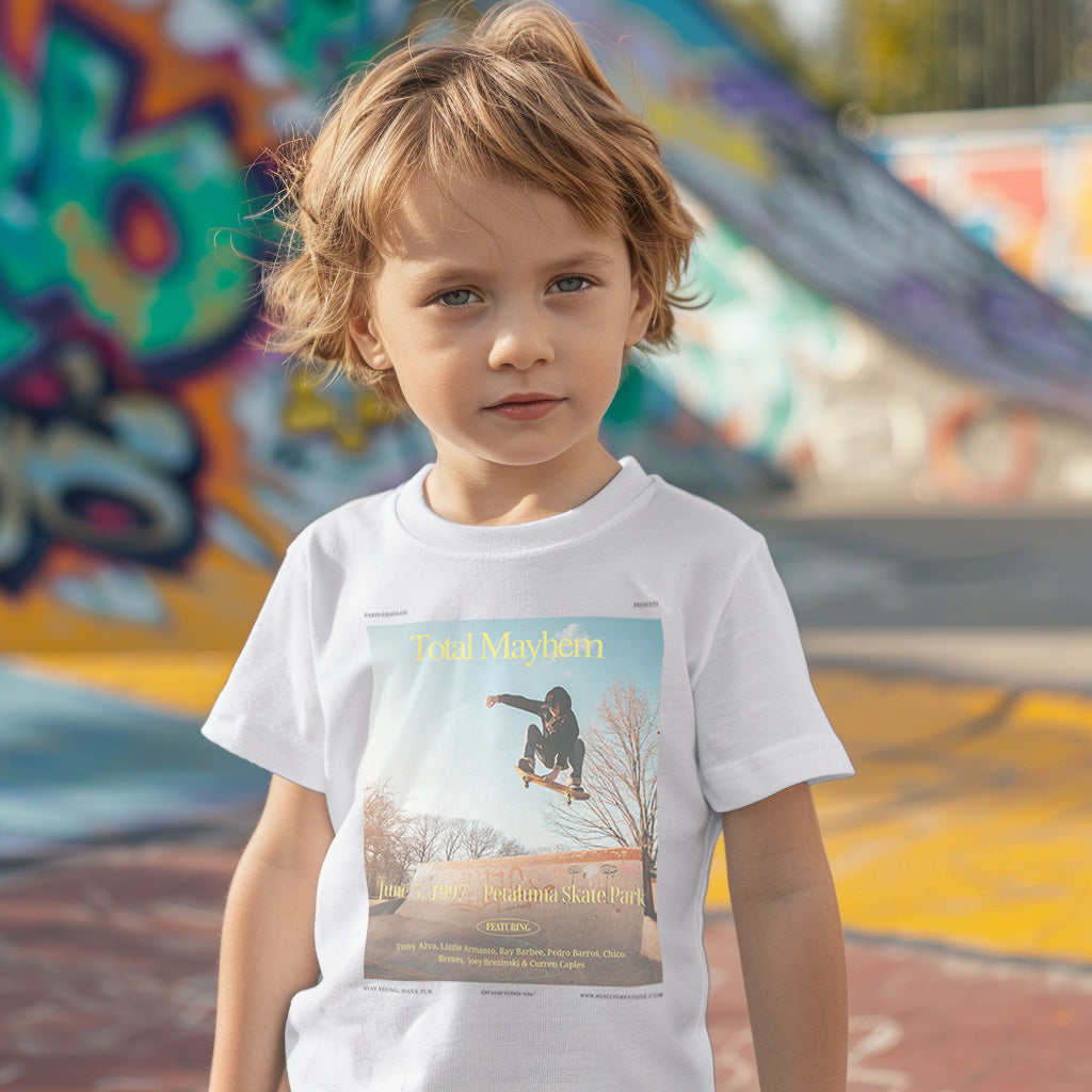 a young boy standing in front of a skateboard ramp