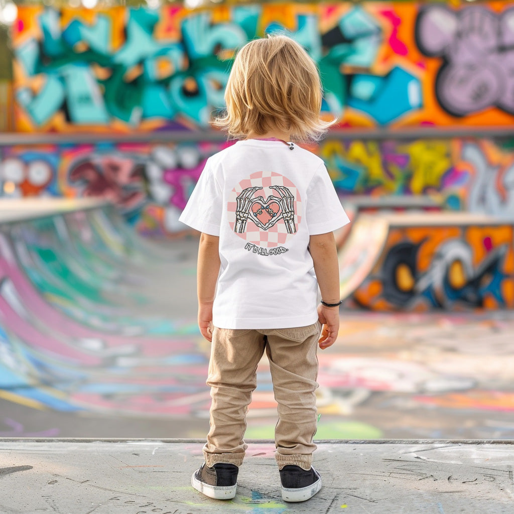 a little boy standing in front of a skateboard ramp