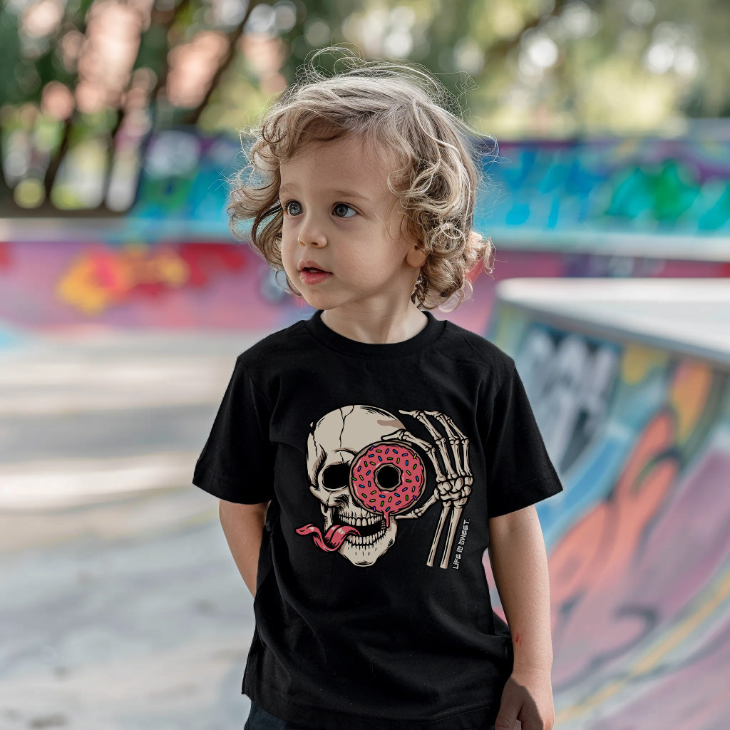 a little girl standing in front of a skateboard ramp