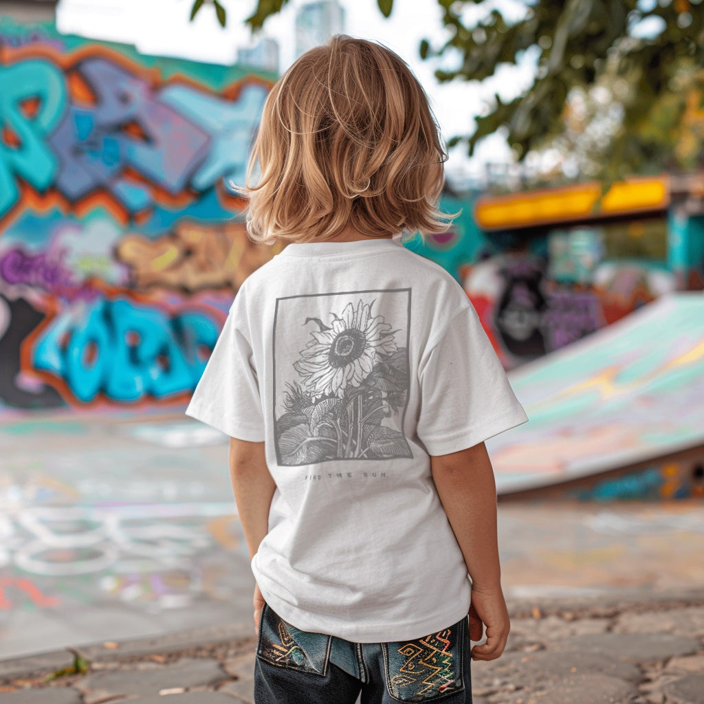 a young boy standing in front of a skateboard ramp